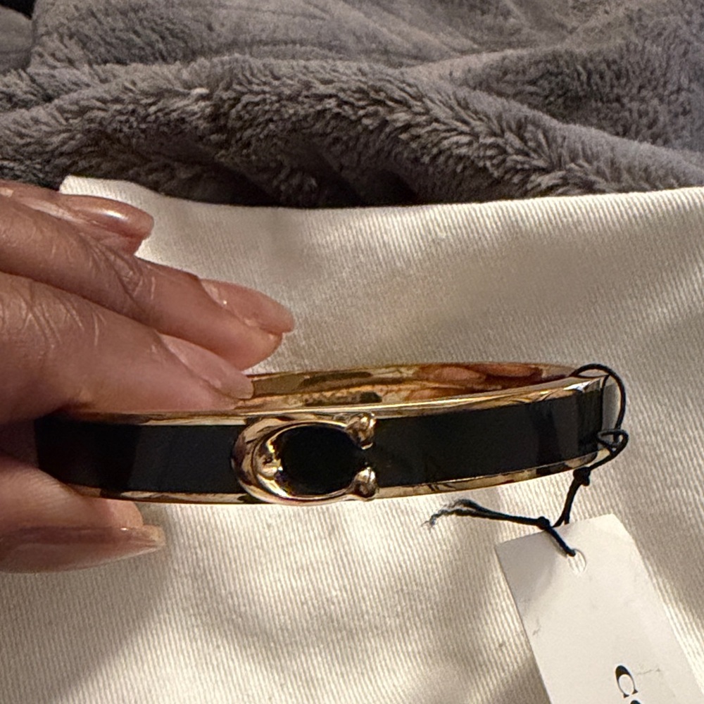 Coach Gold-Tone and Black Enamel Hinged Bangle Bracelet